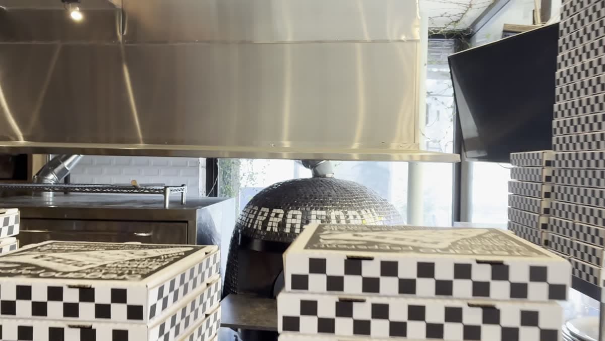 Checker tile and oven detail at Pizzeria Del Sol